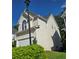 Exterior of a house showcasing a two-car garage, arched windows, and a well-maintained lawn at 3773 Summer Rose Dr, Atlanta, GA 30341