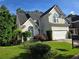 Charming two-story home with lush landscaping and a well-manicured lawn at 3773 Summer Rose Dr, Atlanta, GA 30341
