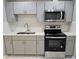 Kitchen featuring grey cabinets, quartz countertops, stainless steel appliances, and subway tile backsplash at 3773 Summer Rose Dr, Atlanta, GA 30341