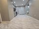 A kitchen with grey cabinets, quartz countertops, stainless steel appliances, and tile flooring at 3773 Summer Rose Dr, Atlanta, GA 30341