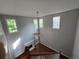 Large living room featuring multiple windows, wood floors, a fireplace and high ceilings at 3773 Summer Rose Dr, Atlanta, GA 30341