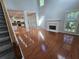Spacious living room with hardwood floors, high ceilings, fireplace, and seamless transition into the kitchen at 3773 Summer Rose Dr, Atlanta, GA 30341