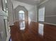 Bright living room featuring hardwood floors, large windows and stylish chandelier at 3773 Summer Rose Dr, Atlanta, GA 30341