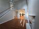 Bright living room with open floor plan, featuring hardwood floors, fireplace, and view of the staircase at 3773 Summer Rose Dr, Atlanta, GA 30341