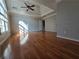 Spacious main bedroom features tray ceilings, hardwood floors and abundant natural light from large windows at 3773 Summer Rose Dr, Atlanta, GA 30341