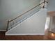 Classic staircase with carpeted steps, wooden handrail, and white spindles, showcasing elegant design at 3773 Summer Rose Dr, Atlanta, GA 30341