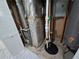 A utility room featuring a furnace, water heater, and sump pump system at 3773 Summer Rose Dr, Atlanta, GA 30341