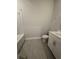 This full bathroom includes a modern vanity and combined shower and tub at 4297 Azalea Ridge Way, Hoschton, GA 30548