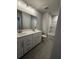 Bathroom features double sinks, generous vanity space, and shower-tub combo at 4297 Azalea Ridge Way, Hoschton, GA 30548
