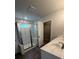 Modern bathroom with marble shower, double vanity, and walk-in closet at 4297 Azalea Ridge Way, Hoschton, GA 30548