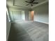 Spacious primary bedroom with neutral decor and carpeted floor at 4297 Azalea Ridge Way, Hoschton, GA 30548