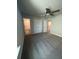 Spacious bedroom features plush carpeting, a ceiling fan, and access to an ensuite bathroom at 4297 Azalea Ridge Way, Hoschton, GA 30548