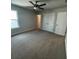 Cozy bedroom features neutral colors, natural light, and a double door closet at 4297 Azalea Ridge Way, Hoschton, GA 30548