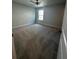 Comfortable bedroom features plush carpeting, natural light, and neutral paint at 4297 Azalea Ridge Way, Hoschton, GA 30548