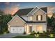 Beautiful two-story home with brick and siding exterior, attached two-car garage, and manicured front lawn at 4297 Azalea Ridge Way, Hoschton, GA 30548