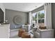 Inviting sitting room featuring modern decor, comfortable seating, and a large window offering natural light at 4297 Azalea Ridge Way, Hoschton, GA 30548