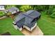 Aerial view of home with new roof and green lawn at 980 Porter Rd, Decatur, GA 30032