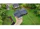 Aerial view of home with new roof and green lawn at 980 Porter Rd, Decatur, GA 30032