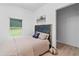 Comfortable bedroom featuring a plush bed, soft lighting, and view to yard at 980 Porter Rd, Decatur, GA 30032