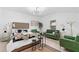 Bright bedroom featuring a comfortable bed, stylish decor, and ample seating at 980 Porter Rd, Decatur, GA 30032