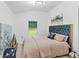 Cozy bedroom with plush bedding, soft lighting, and a peaceful window view at 980 Porter Rd, Decatur, GA 30032