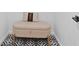 Stylish cushioned bench with black and white floral tile flooring at 980 Porter Rd, Decatur, GA 30032