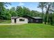 Charming home featuring a spacious front yard and stylish two-tone exterior at 980 Porter Rd, Decatur, GA 30032