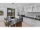 Modern kitchen featuring sleek countertops, an island with seating, and stainless steel appliances at 980 Porter Rd, Decatur, GA 30032