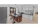 Modern kitchen featuring sleek countertops, an island with seating, and stainless steel appliances at 980 Porter Rd, Decatur, GA 30032