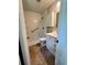 Functional bathroom featuring a shower-tub combo, tiled floors and vanity with sink and drawers at 1040 Forest East Dr, Stone Mountain, GA 30088