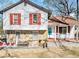 Charming home with stone accents, red shutters, and a welcoming front porch at 1040 Forest East Dr, Stone Mountain, GA 30088