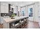 Modern kitchen with island, seating, stainless steel appliances, and sleek countertops at 1427 Hazy Way # 310, Atlanta, GA 30315