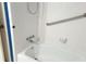 A clean, white bathtub with tiled walls and shower fixtures and a soap holder at 2886 Thornbriar Rd, Atlanta, GA 30340