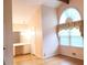 Bright bedroom with large arched window and hardwood floors at 2886 Thornbriar Rd, Atlanta, GA 30340