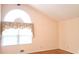Bright bedroom with large arched window and hardwood floors at 2886 Thornbriar Rd, Atlanta, GA 30340