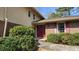 Home featuring a classic red front door and well-maintained landscaping at 2886 Thornbriar Rd, Atlanta, GA 30340