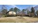 Two-story home with a well-manicured lawn and mature trees at 2886 Thornbriar Rd, Atlanta, GA 30340