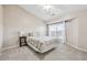 Cozy bedroom with a large window, neutral walls, and a ceiling fan at 3182 Mill Springs Cir, Buford, GA 30519