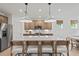 Bright kitchen with pendant lighting, stainless steel appliances, and a large central island with bar seating at 400 Beacon Way, Villa Rica, GA 30180