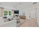 Bright living room featuring stylish furniture, fireplace, and large windows with natural light at 400 Beacon Way, Villa Rica, GA 30180