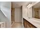 Modern bathroom featuring double sinks, granite countertops, and a glass-enclosed shower at 5215 Wheeler Run Dr, Auburn, GA 30011