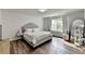 Spacious bedroom offers a comfortable sleeping space with a large window bringing in natural light at 5215 Wheeler Run Dr, Auburn, GA 30011