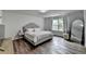 Spacious bedroom offers a comfortable sleeping space with a large window bringing in natural light at 5215 Wheeler Run Dr, Auburn, GA 30011