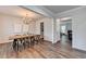 Modern dining room with hardwood floors, and view to the living room at 5215 Wheeler Run Dr, Auburn, GA 30011