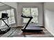 Exercise room features a treadmill and wall mirror, offering space for fitness activities at 5215 Wheeler Run Dr, Auburn, GA 30011