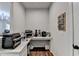 Walk-in pantry area with white countertops, ample appliance storage, and magazine rack at 5215 Wheeler Run Dr, Auburn, GA 30011