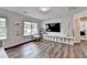 Spacious playroom features natural light, built-in toy storage, and a cozy seating area at 5215 Wheeler Run Dr, Auburn, GA 30011