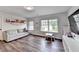 Playroom features comfortable couch, natural light and a tv for entertainment at 5215 Wheeler Run Dr, Auburn, GA 30011