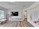 Bright playroom features vinyl wood flooring, ample storage, and natural light from a large window at 5215 Wheeler Run Dr, Auburn, GA 30011