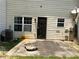 This home features a concrete back patio, perfect for outdoor enjoyment at 6941 Rogers Pt, Lithonia, GA 30058